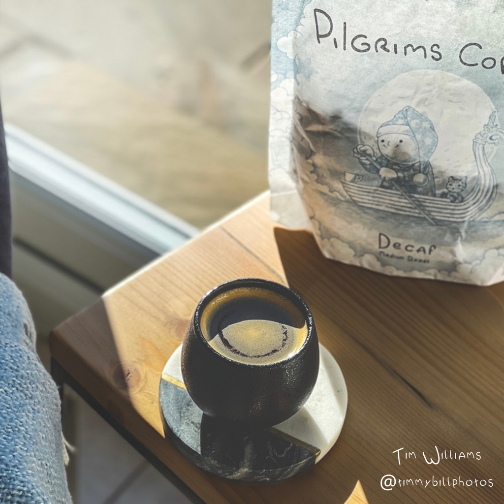 A decaf coffee and a decaf cofffee bag.